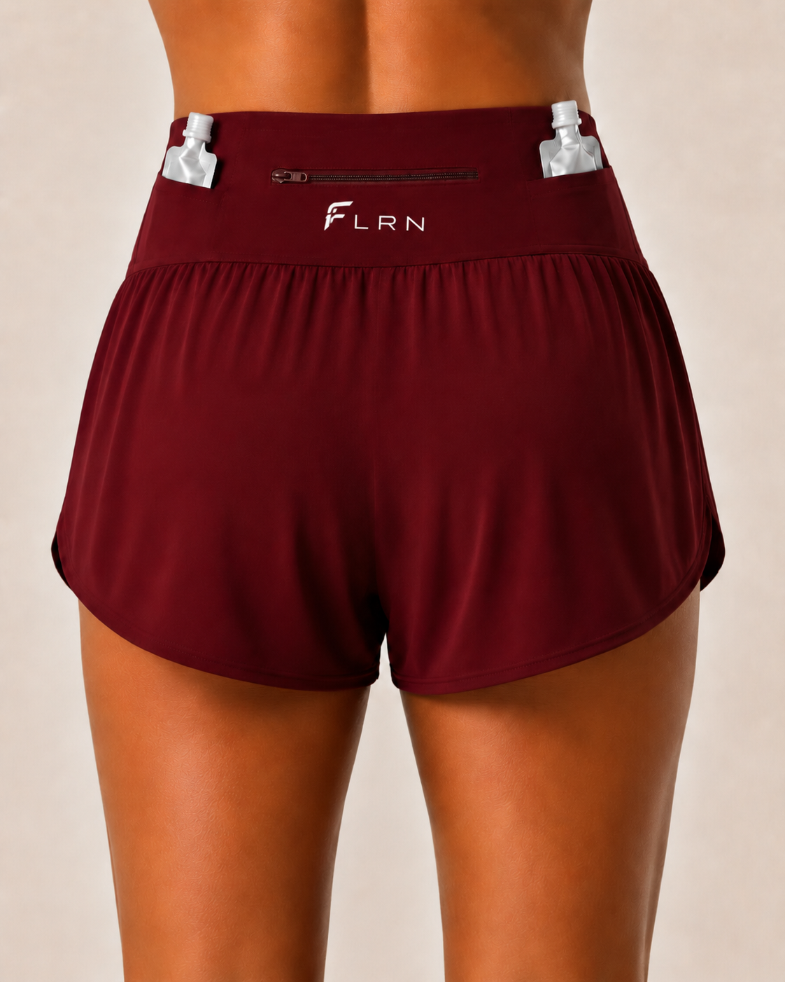 Back view of the FLRN Flow Short showing the zipped waistband pocket and gel storage